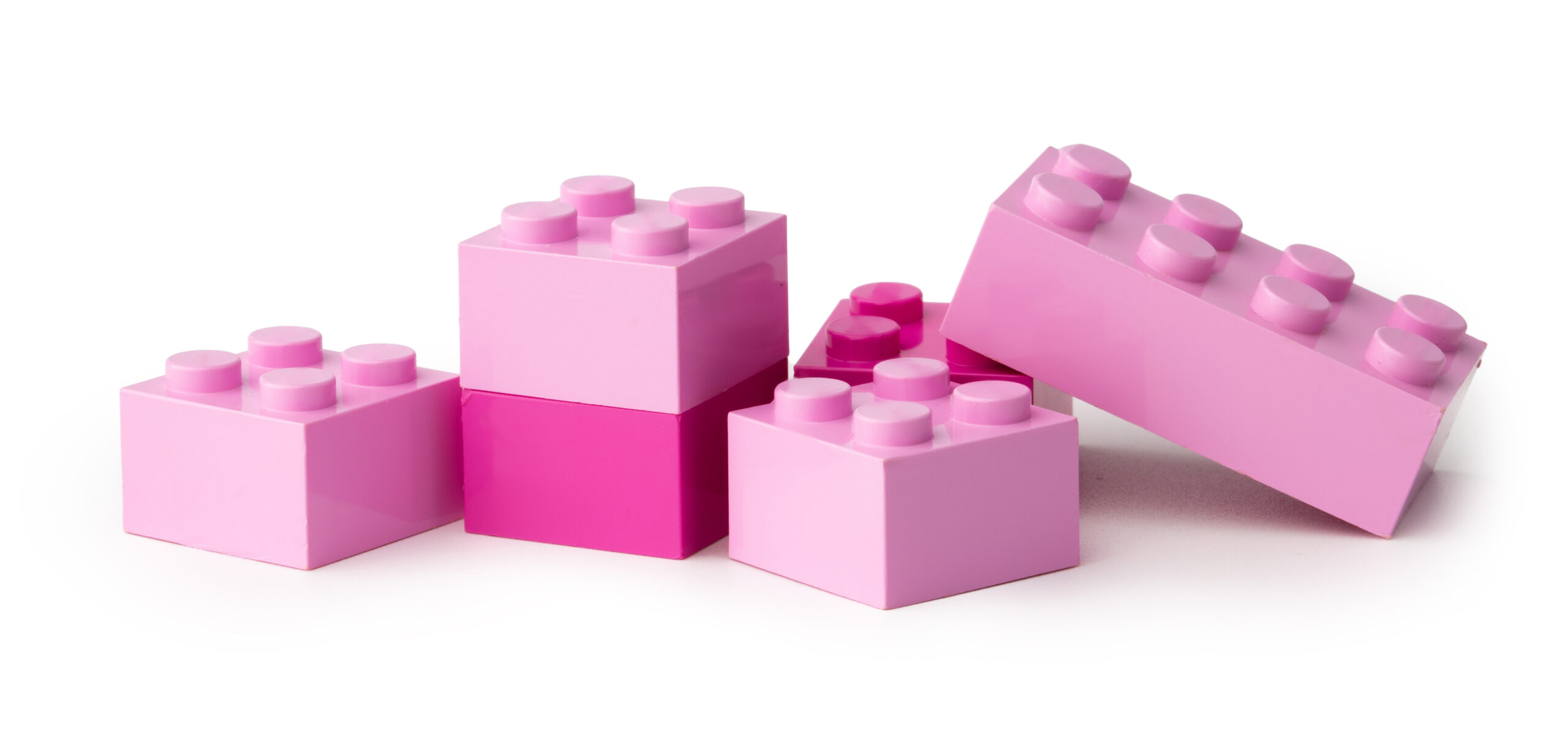 Colorful plastic toy building blocks isolated on white background